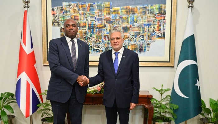 British Foreign Secretary David Lammy (left) and Foreign Minister Ishaq Dar shake hands in Islamabad on May 16, 2025. — Foreign Office