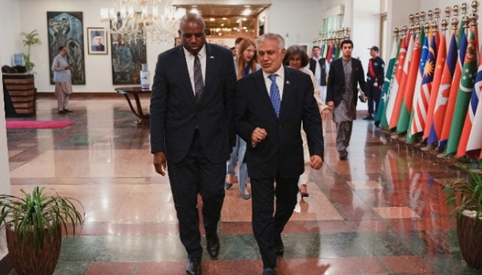 British Foreign Secretary David Lammy (left) and Deputy Prime Minister Ishaq Dar walk together during an event in Islamabad on May 16, 2025. — British High Commission in  Islamabad
