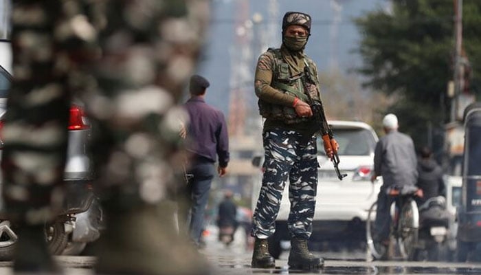 Indian Central Reserve Police Force (CRPF) personnel stand guard on a street in Srinagar, October 12, 2021. — Reuters
