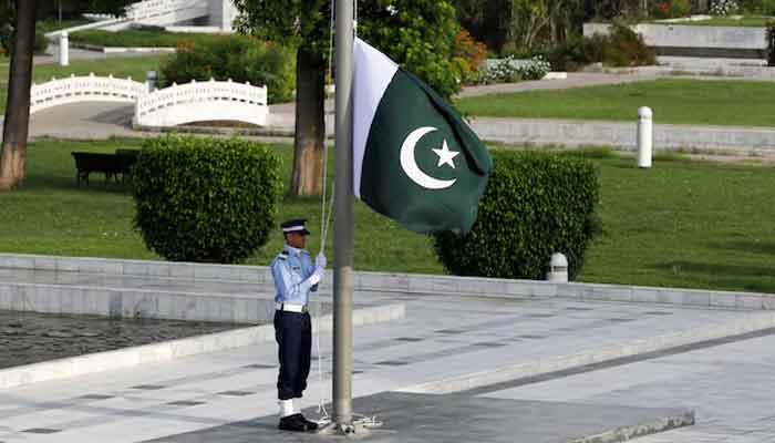 A member of the Pakistan Air Force (PAF) rehearses flag masting at the mausoleum of Muhammad Ali Jinnah before the Defence Day ceremonies, or Pakistans Memorial Day, in Karachi, September 6, 2020. — Reuters