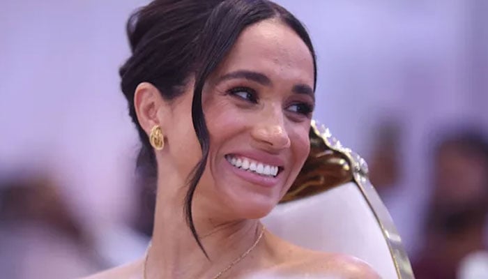 Meghan Markle seems to be amping up her PDA to prove a point