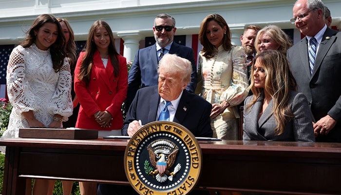 US President Donald Trump signs the bill during the ceremony for the Take it Down Act, in the Rose Garden of the White House in Washington, D.C., U.S., May 19, 2025. — Reuters