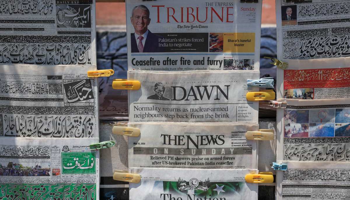 A general view of newspapers headlines, a day after the ceasefire announcement between India and Pakistan, at a stall in Islamabad on May 11, 2025. — Reuters