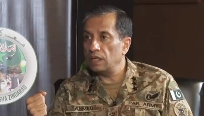 DG ISPR Lieutenant General Ahmed Sharif Chaudhry gestures during the interview. — Screengrab/CGTN