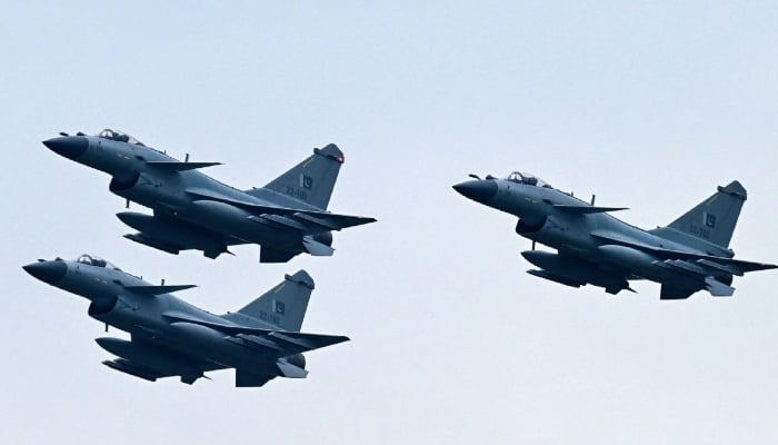 Pakistan Air Force J-10C fighter jets rehearse ahead of a national day event in Islamabad. — AFP/File