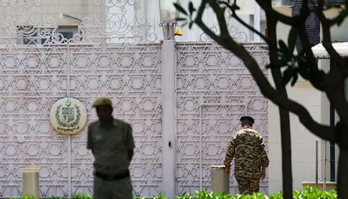 Security personnel stand outside the gate of Pakistan High Commission in New Delhi, India, May 8, 2025. — Reuters