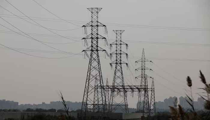 A power transmission tower is seen a day after a country-wide power breakdown, in Karachi, January 24, 2023. — Reuters