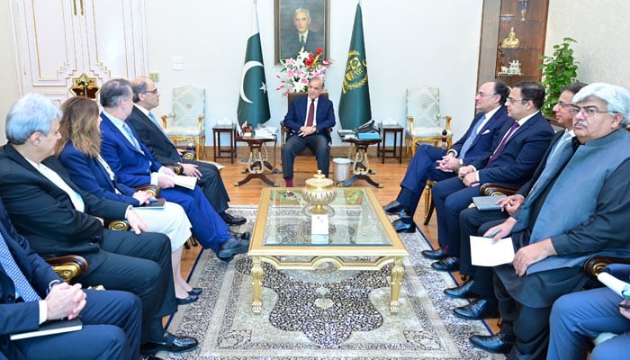 A delegation of International Monetary Fund (IMF) led by Jihad Azour calls on Prime Minister Shehbaz Sharif (centre) in Islamabad on May 22, 2025. — PID