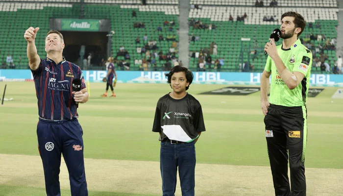 Karachi Kings captain David Warner (left) flips the coin as Lahore Qalandars captain Shaheen Shah Afridi looks on at the toss for their PSL 10 Eliminator 1 at the Gaddafi Stadium in Lahore on May 22, 2025. — PCB