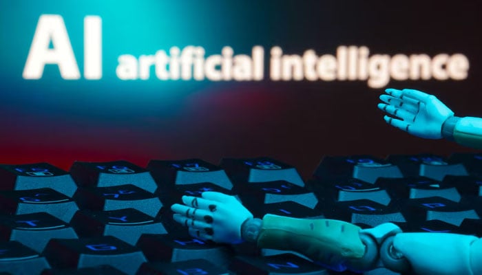 A message reading AI artificial intelligence, a keyboard, and robot hands are seen in this illustration taken January 27, 2025 — Reuters