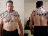 Iranian man breaks his own Guinness Record by balancing 96 spoons on body
