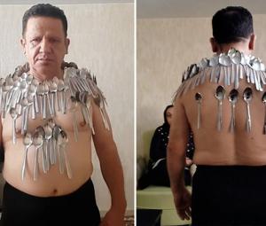 Iranian man breaks his own Guinness Record by balancing 96 spoons on body