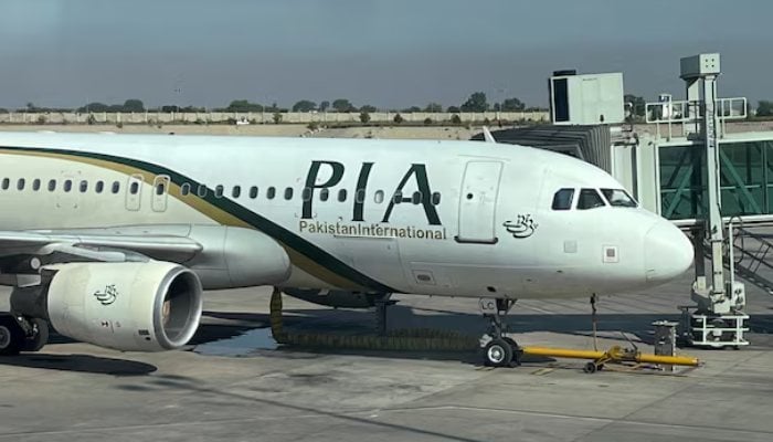 View of the Pakistan International Airlines (PIA) passenger plane, taken through a glass panel, at Islamabad International Airport, Pakistan October 3, 2023. — Reuters