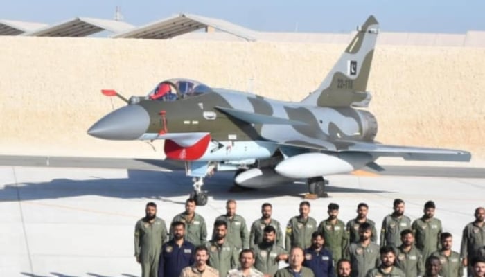 PAF officials posing for a picture with a J-10C fighter aircraft. — Facebook/@DGPR.PAF/File