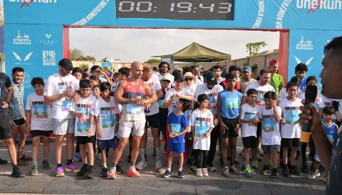 Participants of the half marathon can be seen getting ready at the starting point in DHA, Karachi, on May 24, 2025. — Reporter