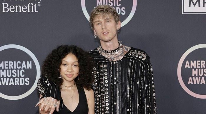 Machine Gun Kelly and daughter Casie celebrating