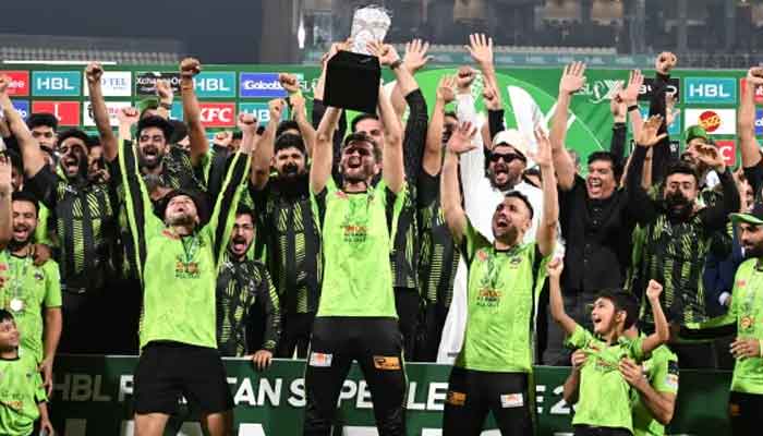 Lahore Qalanders captain Shaheen Shah Afridi (centre) celebrates with his teammates and staff members after winning the Pakistan Super League final against Quetta Gladiators at the Qaddafi Stadium in Lahorem Pakistan on May 25, 2025. — AFP