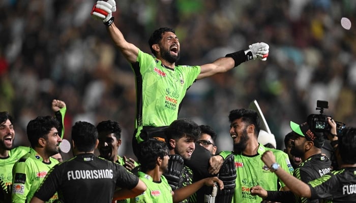 Lahore Qalandars players carry teammate Sikandar Raza as they celebrate after their victory in the PSL X final match between Lahore Qalandars and Quetta Gladiators at the Gaddafi Stadium in Lahore on May 25, 2025. — AFP