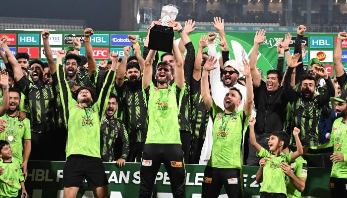 Captain Lahore Qalanders celebrates Shaheen Shah Aphraidi (C) with the cup with the players during the victory ceremony at the end of the Pakistan Premier League (PSL) in Lahore Qalandars and QUETTA Gladiators in Qadddafi Cricket Indium in Lahore on May 25, 2025.