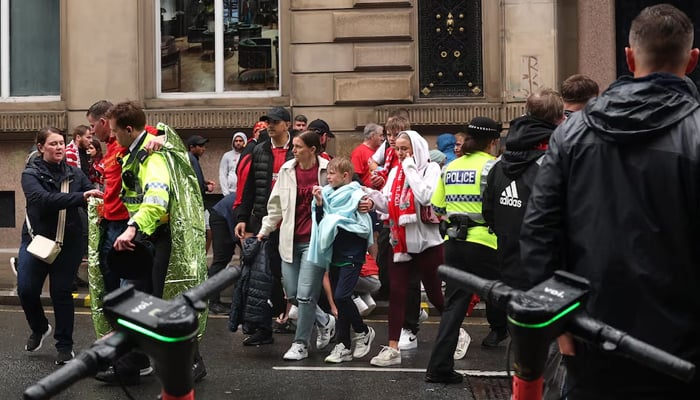 Soccer Football - Premier League - Liverpool Victory Parade - Liverpool, Britain - May 26, 2025 Liverpool fans look on after multiple people were hit by a car during the Victory parade. — Reuters