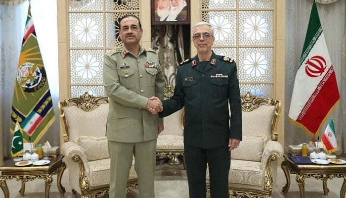 Field Marshal Asim Munir (left) shakes hand with Iranian Armed Forces Chief of General Staff Major General Mohammad Bagheri at the General Staff Headquarters in Tehran on May 27, 2025. — ISPR