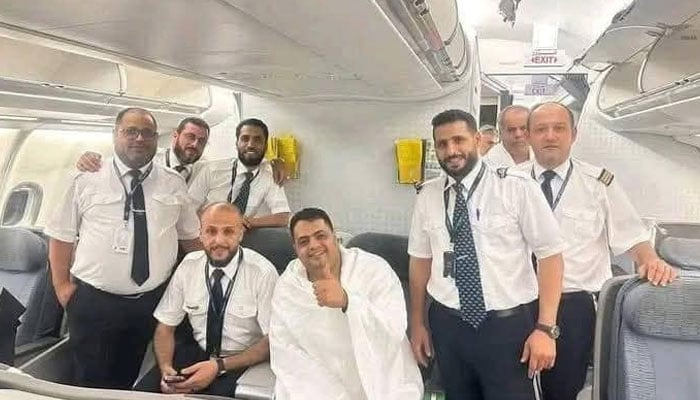 Amer Al Mahdi Mansour Al Gaddafi poses for photo alongside flight crew. — Facebook/Masroor Shaheen/File