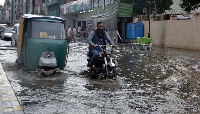 Commuters are facing difficulties in transportation due to stagnant rain water after downpour due to poor sewerage system at Saddar Road, Peshawar, Khyber Pakhtunkhwa, May 27, 2025. — PPI