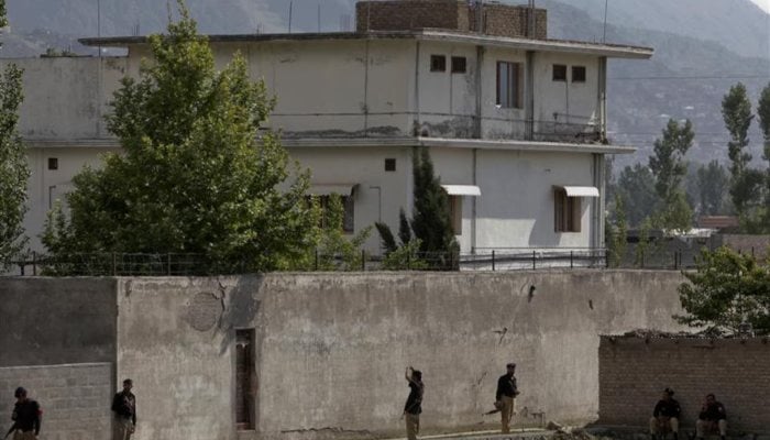 Members of the anti-terrorism squad are seen surrounding the compound where Al Qaeda leader Osama bin Laden was killed in Abbottabad, on May 4, 2011. — Reuters