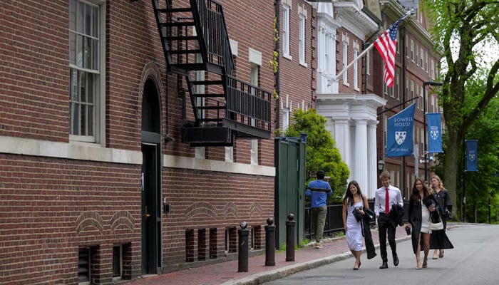 Students walk on the campus of Harvard University in Cambridge, Massachusetts, US, May 23, 2025. — Reuters