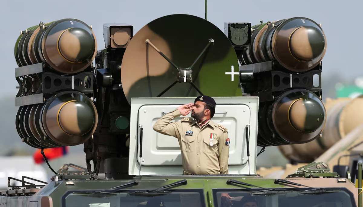 Pakistani Army soldier salutes while standing on an air defence missile system during Pakistan Day military parade in Islamabad, Pakistan, March 23, 2022. — Reuters