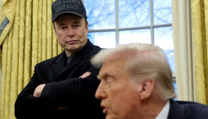 Elon Musk listens to US President Donald Trump speak in the Oval Office of the White House in Washington, US, on February 11, 2025. — Reuters