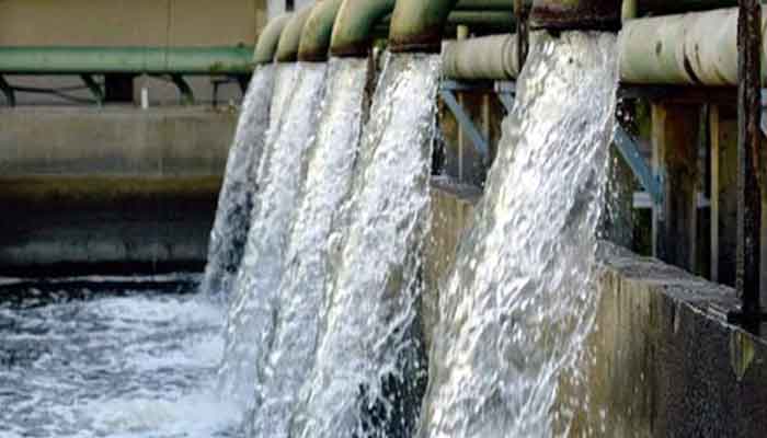 The image shows water flowing from a water pumping station. — APP/File