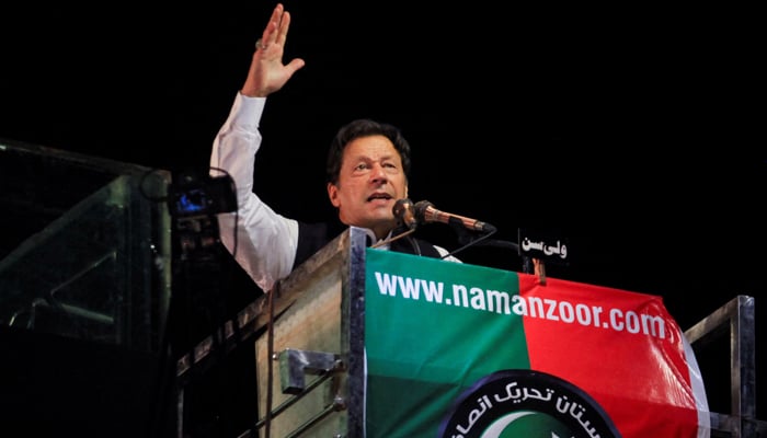 PTI founder Imran Khan gestures as he addresses supporters during a rally, in Lahore, April 21, 2022. — Reuters