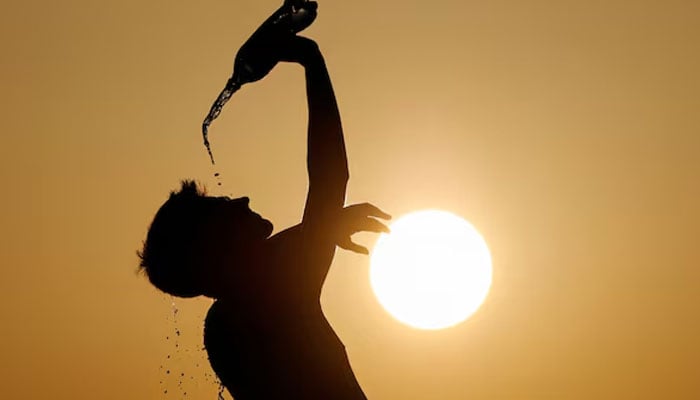 This representational image shows a runner cools down with water in Skopje, North Macedonia July 12, 2023.  — Reuters