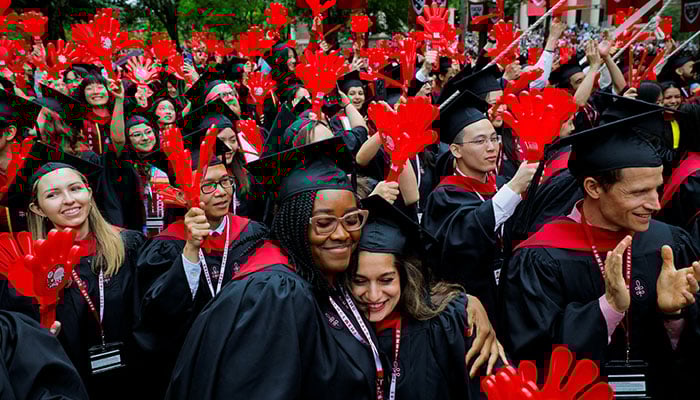 Graduating students react during the 374th Commencement exercises at Harvard University in Cambridge, Massachusetts, U.S., May 29, 2025. — Reuters