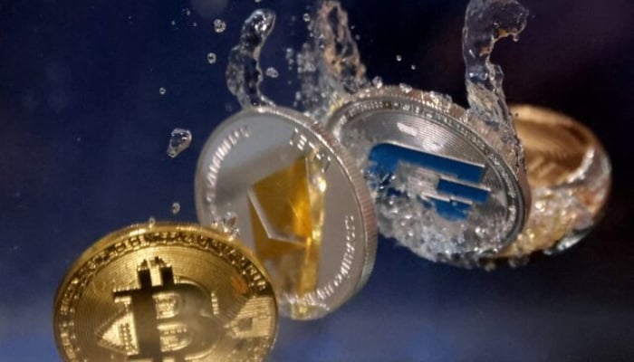 Representations of cryptocurrencies plunge into water in this illustration taken on May 23, 2022. — Reuters