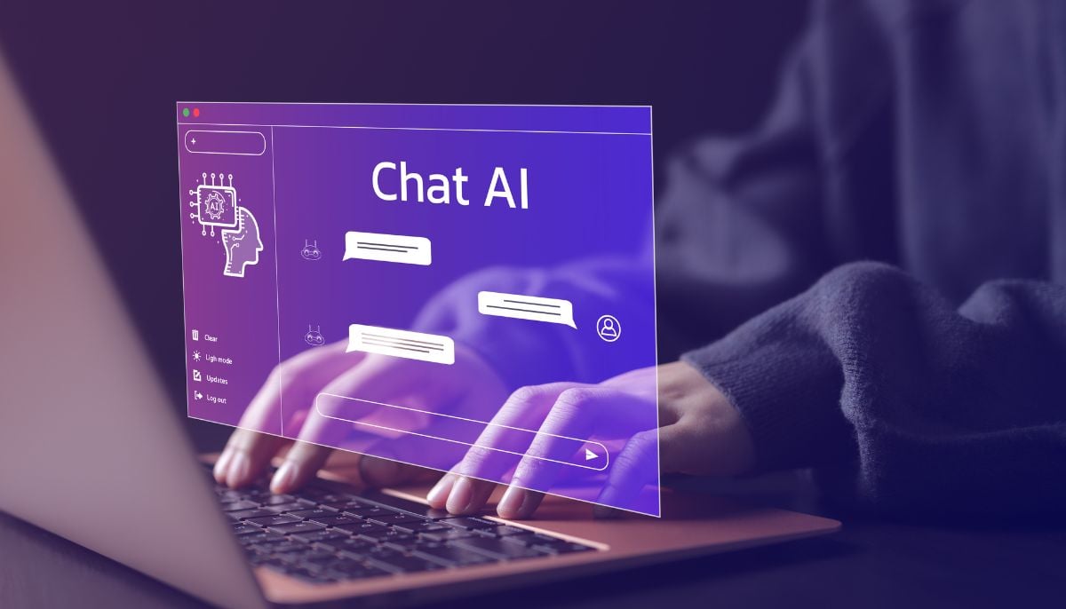 A representational image of a person typing on their laptop to use an AI chatbot. — Canva