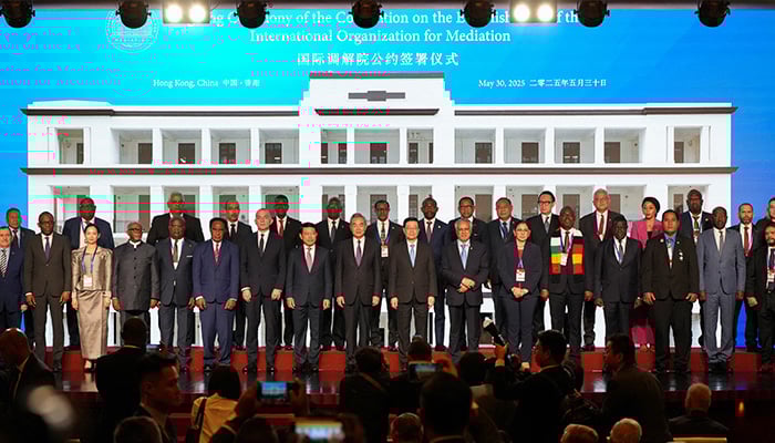 Chinese Foreign Minister Wang Yi, Hong Kong Chief Executive John Lee, Foreign Minister Ishaq Dar and Swiss Foreign Minister Ignazio Cassis pose for photos after a signing ceremony of the Convention on the Establishment of The International Organization for Mediation (IOMed) in Hong Kong, China May 30, 2025. — Reuters