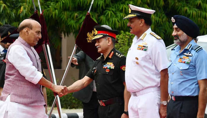 Indias Defence Minister Rajnath Singh shakes hands with Army Chief Upendra Dwivedi as Navy Chief Admiral Dinesh Kumar Tripathi and Air Chief Marshal Amar Preet Singh look on before the ceremonial reception of Japans defence minister in New Delhi, India, May 5, 2025. — Reuters