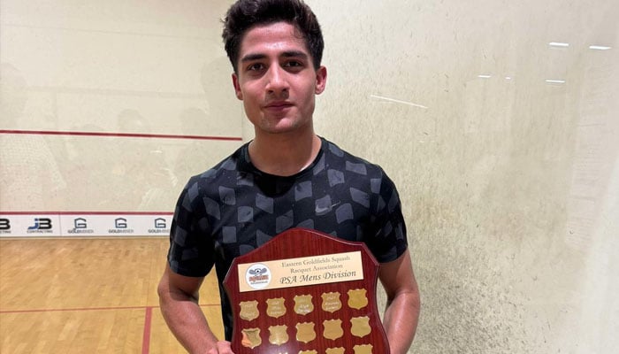 Hamza Khan from Pakistan is posing with the winning trophy at Mens Golden Open Squash Championship happened in Kalgoorlie, Australia — Reporter