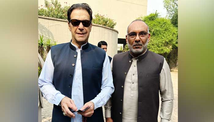 Jailed PTI founder Imran Khan (left) is pictured along with Pakistani-American tycoon Tanweer Ahmed.— Reporter/File