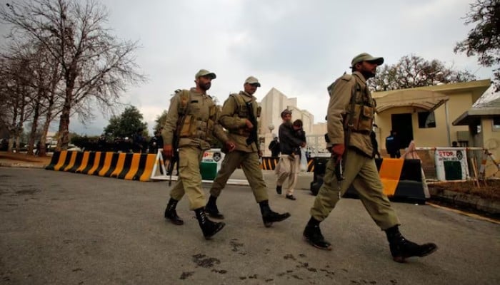 Paramilitary soldiers walk past the Supreme Court building in Islamabad. — Reuters/File