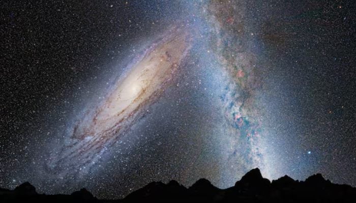An illustration shows a stage in the potential merger between the Milky Way galaxy and the neighbouring Andromeda galaxy, as viewed in Earths night sky in 3.75 billion years. — Reuters/File