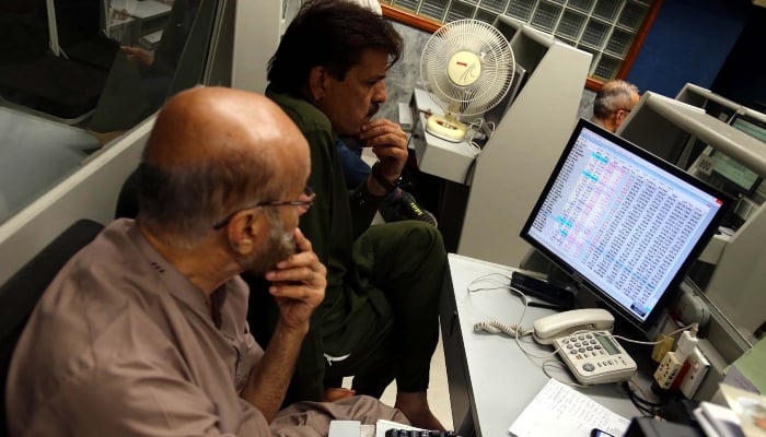 Brokers are busy in trading at Pakistan Stock Exchange (PSX) in Karachi on Friday, April 4, 2025. — APP