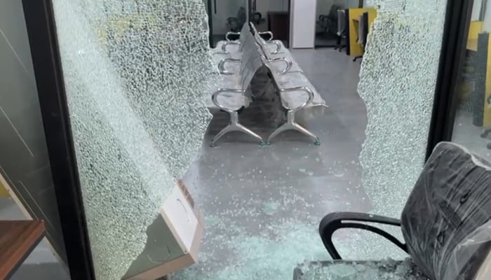 Glass can be seen shattered in an office inside the Malir prison. — Geo News