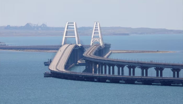 A view shows the Crimean Bridge, a section of which was damaged by an alleged overnight attack, as seen form the city of Kerch, Crimea. — Reuters/File