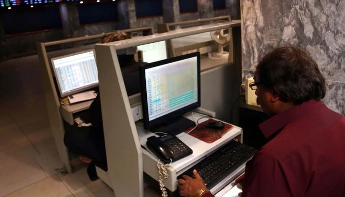 Broker is busy in trading at Pakistan Stock Exchange (PSX) in Karachi on Friday, April 4, 2025. — APP