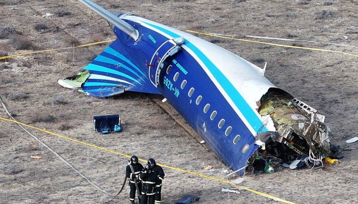 A drone view shows emergency specialists working at the crash site of an Azerbaijan Airlines passenger plane near the city of Aktau, Kazakhstan December 25, 2024. — Reuters