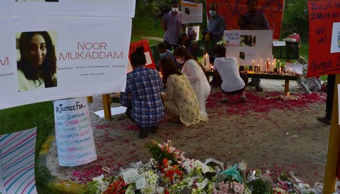 Women rights activists light candles at a park in Islamabad on July 25, 2021, against the brutal killing of Noor Mukadam, the daughter of former Pakistan envoy to South Korea, in Islamabad. — AFP