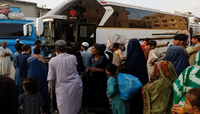 Afghan people gather to board a bus to return home, after Pakistan gave the last warning to undocumented migrants to leave, at a bus stop in Karachi, Pakistan.— Reuters/File